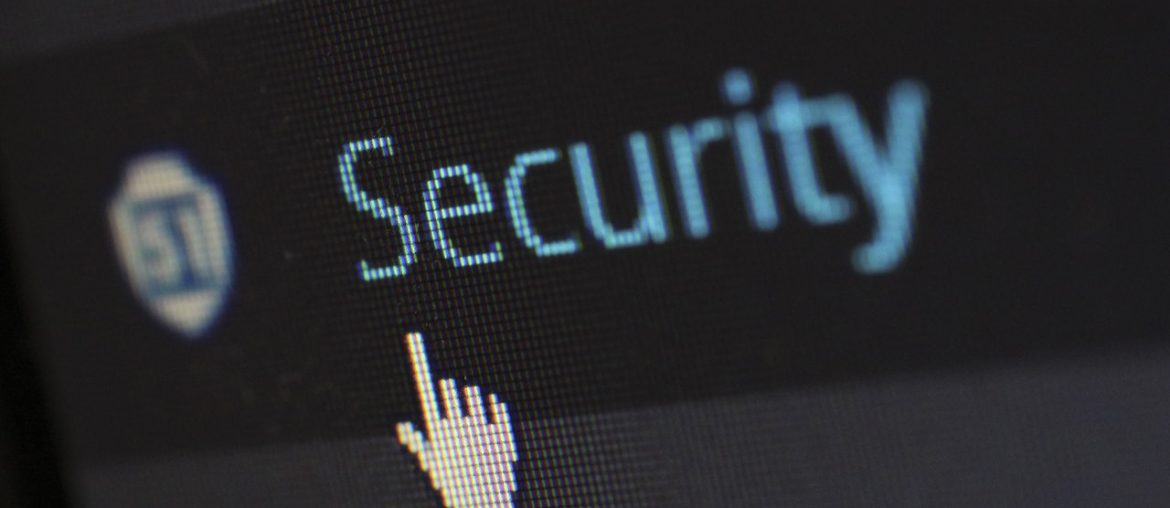 How to Protect Yourself from Hackers Cursor pointing to security option on computer screen with security shield icon visible