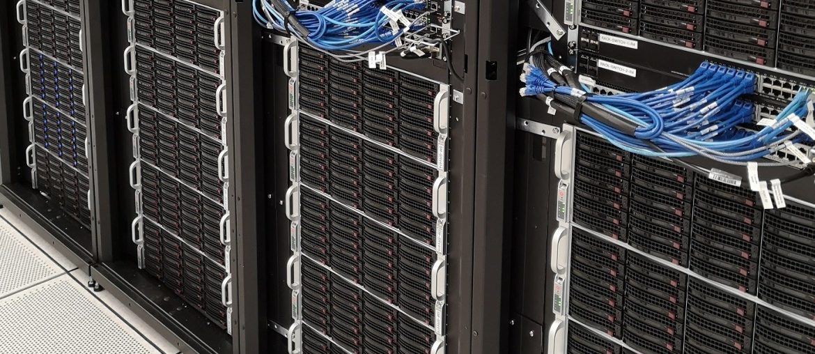Close-up of a data center server rack with numerous network cables and equipment neatly organized.
