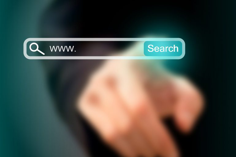 Hand pointing at virtual search bar with www. and Search button on dark background.
