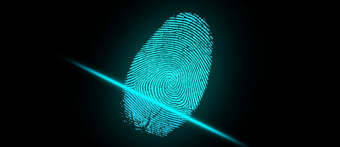 Glowing blue fingerprint on black background being scanned by a laser beam, symbolizing digital security.