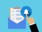 Checklist in envelope with hand tapping notification bell for alerts on blue background.