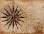 Vintage compass rose and old ship illustration on an antique map background, highlighting navigation history.