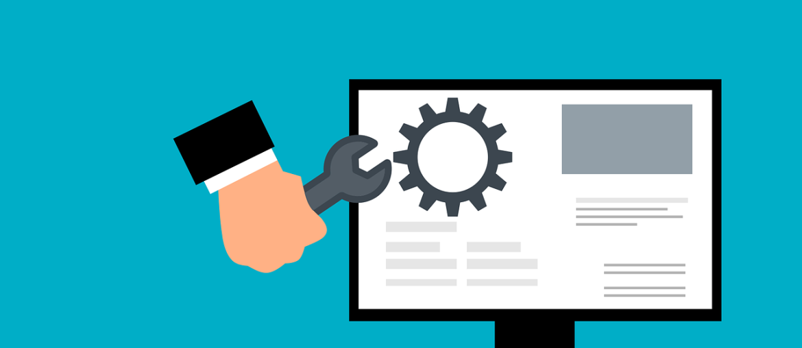 What Exactly is Uptime, and How to Monitor it for Free Illustration of a hand holding a wrench next to a computer monitor displaying a gear symbol on the screen.