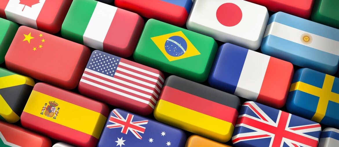 Colorful 3D blocks with flags of various countries, including Canada, Italy, Japan, USA, and Brazil, representing diversity.