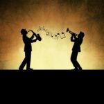 Silhouetted musicians playing saxophone and trumpet on warm vintage background with musical notes.